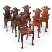 A SET OF SIX EARLY VICTORIAN MAHOGANY HALL CHAIRS