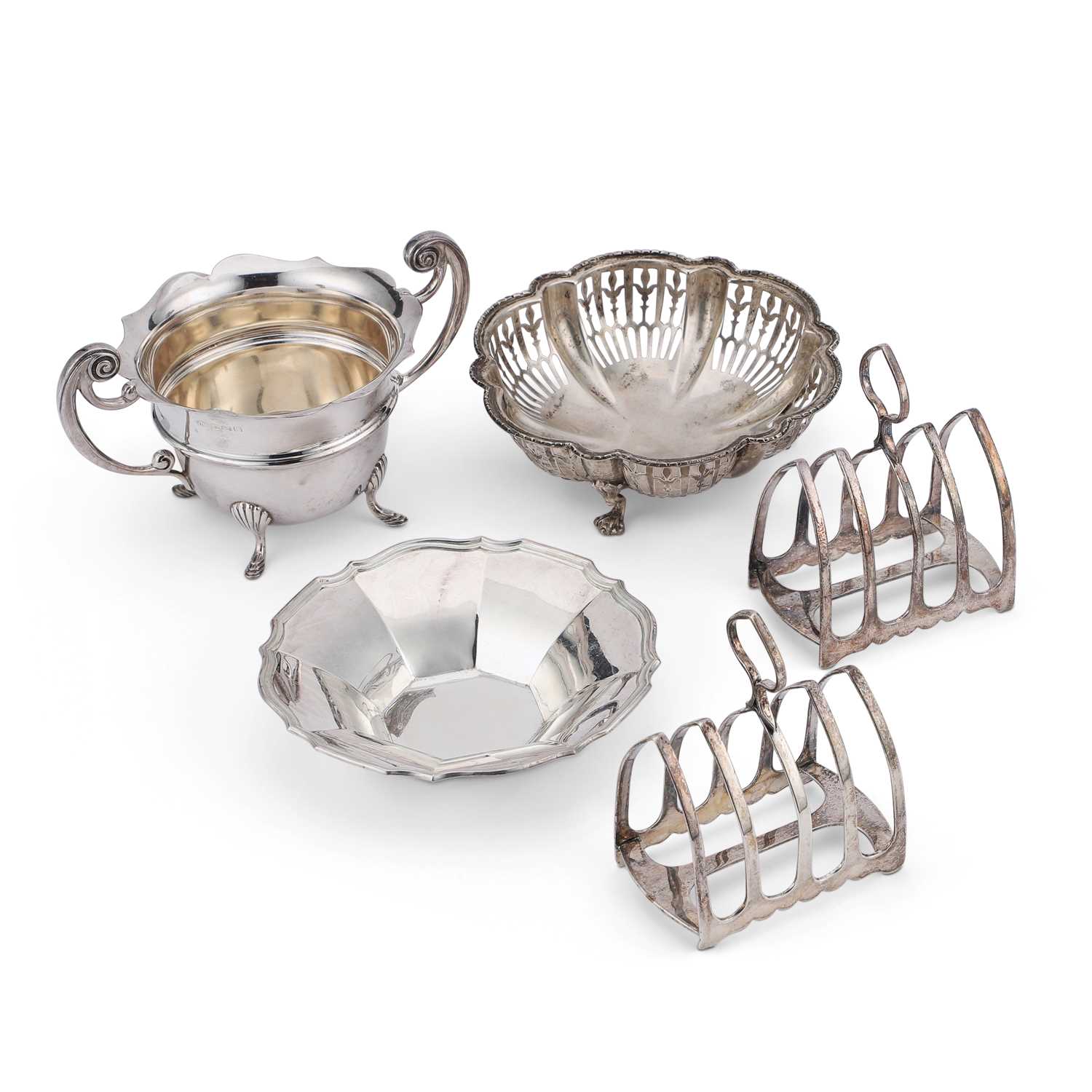 A NEAR PAIR OF GEORGE V SILVER FIVE-BAR TOAST RACKS