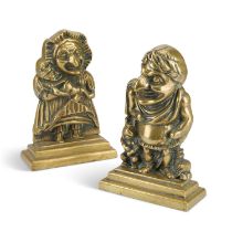 A PAIR OF VICTORIAN BRASS PUNCH AND JUDY DOOR STOPS