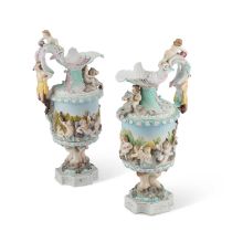 A NEAR PAIR OF GERMAN PORCELAIN EWERS, CIRCA 1900