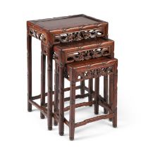 A SET OF THREE CHINESE HARDWOOD NESTING TABLES, EARLY 20TH CENTURY