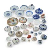 A LARGE COLLECTION OF CHINESE PORCELAIN VASE LIDS AND OTHER OBJECTS