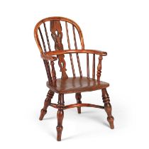 A 19TH CENTURY YEW WOOD CHILD'S WINDSOR CHAIR