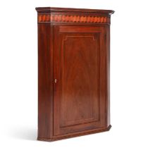 A GEORGE III INLAID MAHOGANY HANGING CORNER CUPBOARD