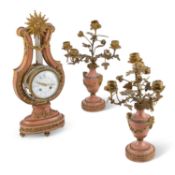 A 19TH CENTURY FRENCH PINK MARBLE AND ORMOLU CLOCK GARNITURE IN LOUIS XVI STYLE
