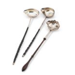 THREE GEORGIAN SILVER TODDY LADLES