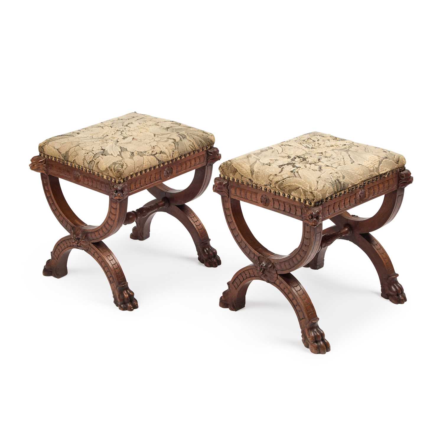 A PAIR OF VICTORIAN GOTHIC REVIVAL OAK AND UPHOLSTERED STOOLS