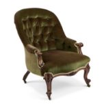A VICTORIAN WALNUT AND UPHOLSTERED BUTTON-BACK ARMCHAIR