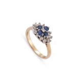 A 9 CARAT GOLD DIAMOND AND SAPPHIRE CLUSTER RING