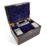 A VICTORIAN BRASS-BOUND COROMANDEL TRAVELLING DRESSING CASE