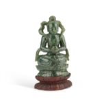 A CHINESE SPINACH JADE FIGURE OF A BODHISATTVA