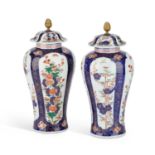 A PAIR OF CONTINENTAL PORCELAIN VASES AND COVERS, CIRCA 1900