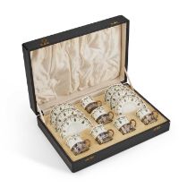 A CASED SET OF SIX ROYAL WORCESTER SILVER-MOUNTED COFFEE CANS AND SAUCERS