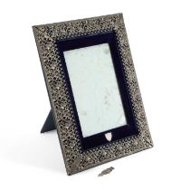 A 19TH CENTURY WHITE-METAL MOUNTED PHOTOGRAPH FRAME