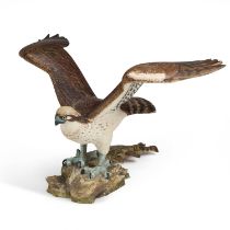 HOWARD CARTER, A CARVED AND PAINTED WOODEN MODEL OF AN EAGLE WITH A PIKE IN IT'S TALONS
