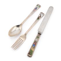 AN ART DECO SILVER AND ENAMEL THREE-PIECE CHRISTENING SET