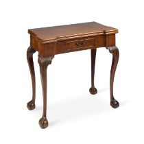 A LATE 19TH CENTURY MAHOGANY FOLDOVER GAMES TABLE IN GEORGE II IRISH STYLE