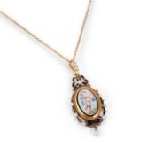 AN ENAMEL AND SEED PEARL PENDANT