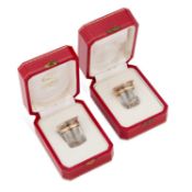 TWO CARTIER SILVER-TOPPED PEPPER POTS