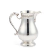 A GEORGIAN STYLE SILVER BEER JUG