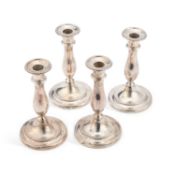 A SET OF FOUR GEORGE III SILVER CANDLESTICKS