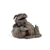 A CHINESE BRONZE MODEL OF A BUDDHIST LION, 19TH CENTURY