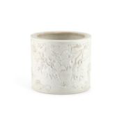 A CHINESE CARVED BISCUIT PORCELAIN BRUSH POT