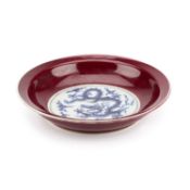 A CHINESE UNDERGLAZE BLUE AND SANG-DE-BOEUF 'DRAGON' DISH