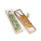 A NEPHRITE BEAD NECKLACE, A NEPHRITE BEAD BRACELET AND A CHINESE NEPHRITE CARVING