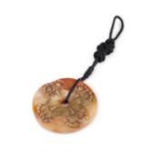 A CHINESE CARVED JADE BI-DISC