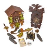 A VINTAGE CUCKOO CLOCK AND A MODERN CUCKOO CLOCK