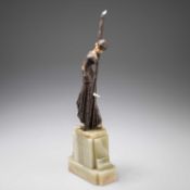 AN ART DECO BRONZE AND FAUX IVORY FIGURE