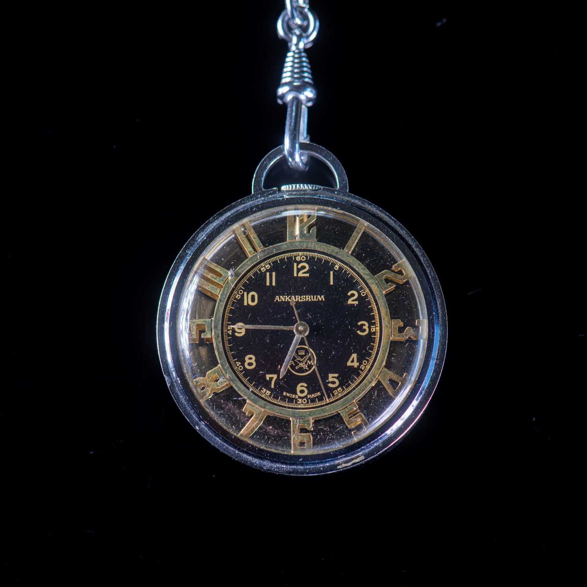 A WHITE METAL ANKARSRUM OPEN FACED POCKET WATCH