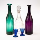 TWO COLOURED GLASS FLUTED SPIRIT DECANTERS, CIRCA 1830