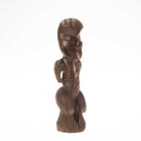 TRIBAL: A MAORI CARVED WOODEN FIGURE