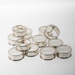 A SET OF TWELVE ELIZABETH II SILVER NAPKIN RINGS