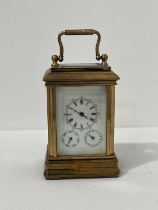 A MINIATURE GILT-BRASS CARRIAGE CLOCK