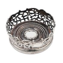 AN EARLY VICTORIAN SILVER WINE COASTER