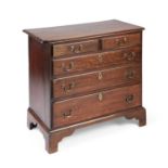 A SMALL GEORGE III OAK CHEST OF DRAWERS