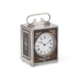 AN EDWARDIAN SILVER AND TORTOISESHELL TRAVELLING CLOCK