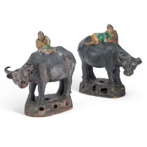 A PAIR OF CHINESE POTTERY FIGURES OF BUFFALO