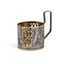 AN EARLY 20TH CENTURY RUSSIAN SILVER-GILT AND NIELLO TEA GLASS HOLDER