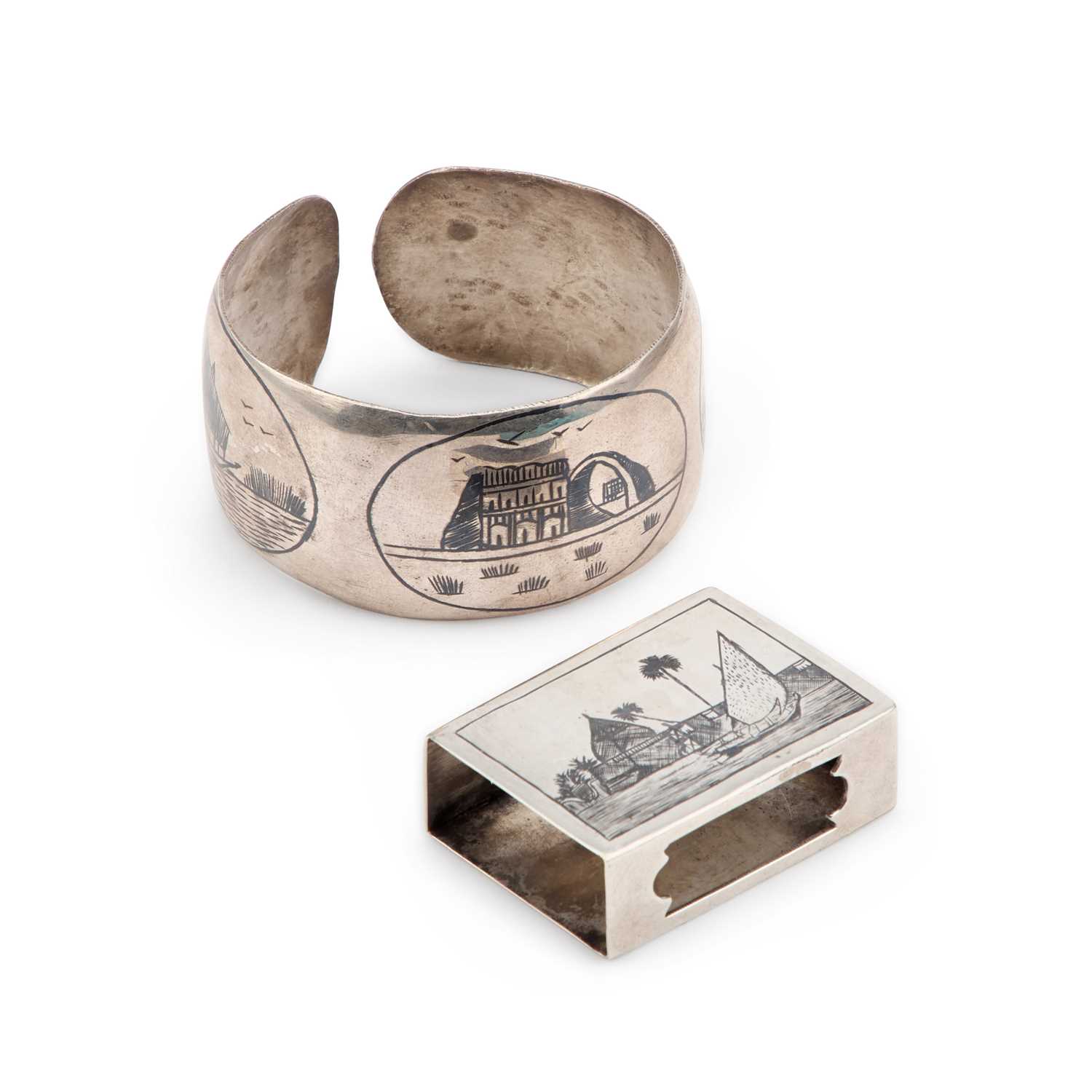 A SILVER AND NIELLO BANGLE AND MATCHBOX SLEEVE