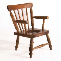 A VICTORIAN BEECH CHILD'S COMMODE CHAIR