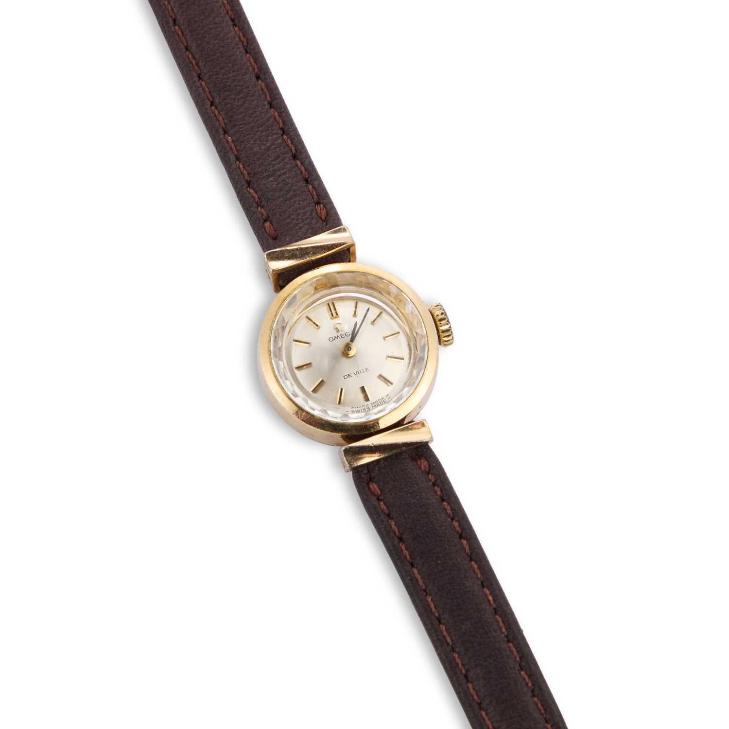 A LADYS GOLD PLATED OMEGA STRAP WATCH