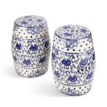 A PAIR OF BLUE AND WHITE POTTERY GARDEN SEATS IN THE CHINESE TASTE