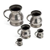 A GRADUATED SET OF FIVE VICTORIAN PEWTER BALUSTER MEASURES