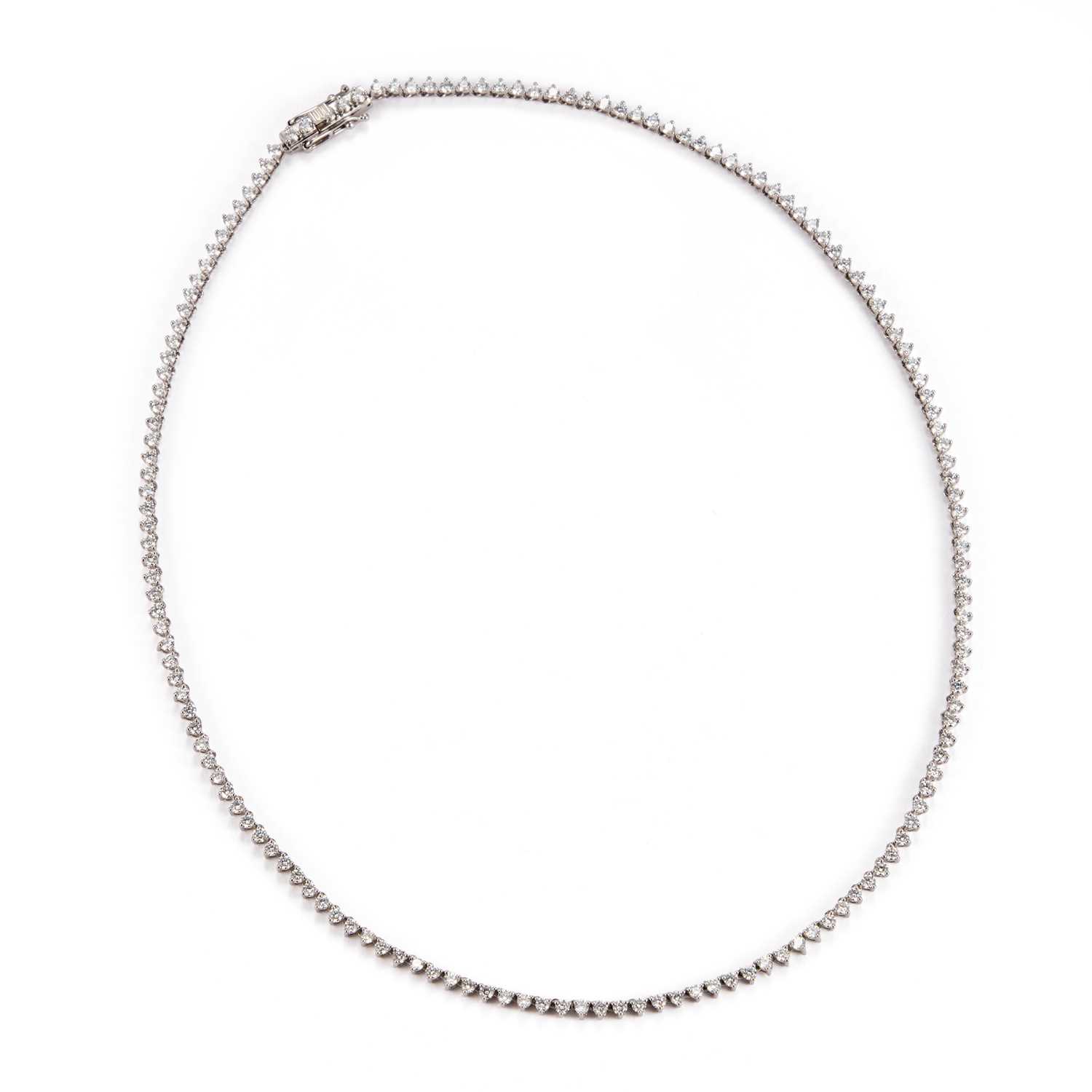 A PLATINUM AND DIAMOND LINE NECKLACE