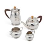 LIBERTY & CO: AN ARTS AND CRAFTS SILVER FOUR-PIECE TEA SERVICE