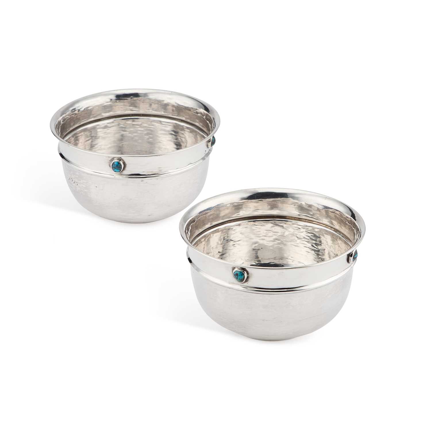 LIBERTY & CO: A PAIR OF ARTS AND CRAFTS SILVER BOWLS